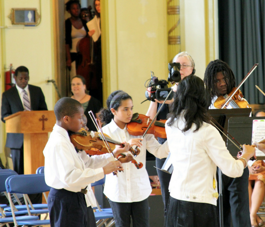Play On, Philly! students performing last year at Saint Francis de Sales School.